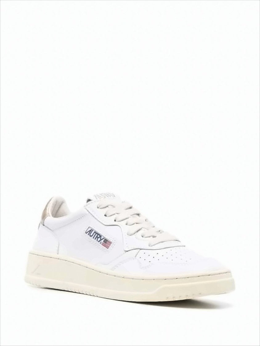 Smooth White Leather Low-Top Sneakers with Metallic Accents