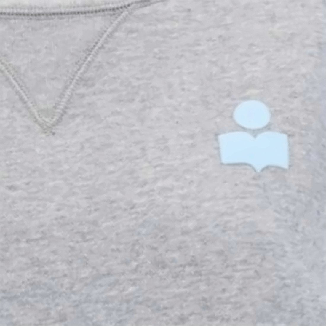 Relaxed Fit Long-Sleeve Top With Adjustable Hem And V-Stitch Detail