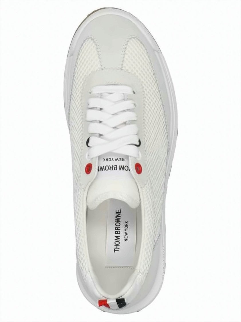 White Sneakers with Suede Overlays and Striped Detailing
