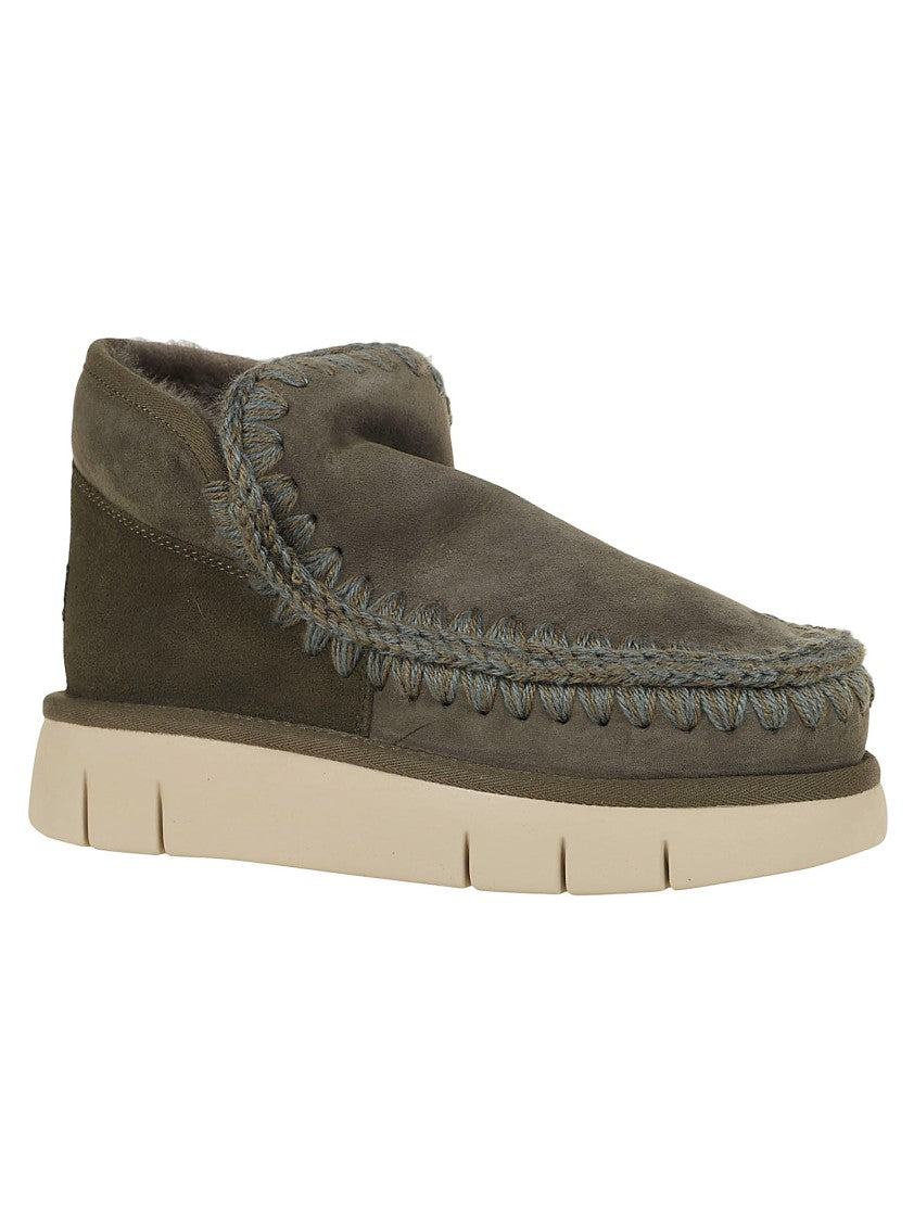Moccasin-Inspired Ankle Boots With Whipstitch Detailing