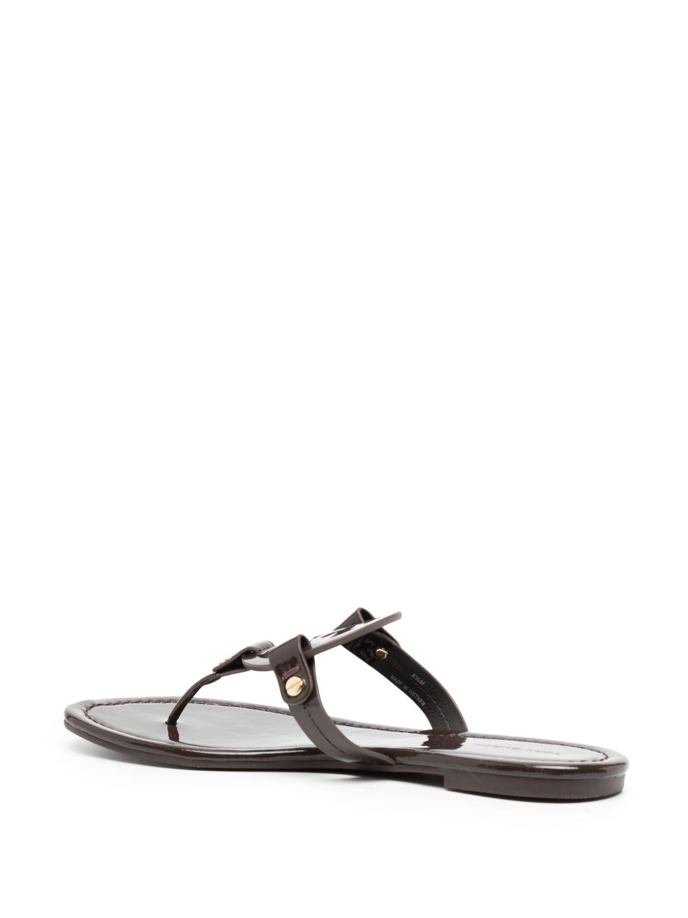 Glossy Black Flats With Circular Emblem Detail