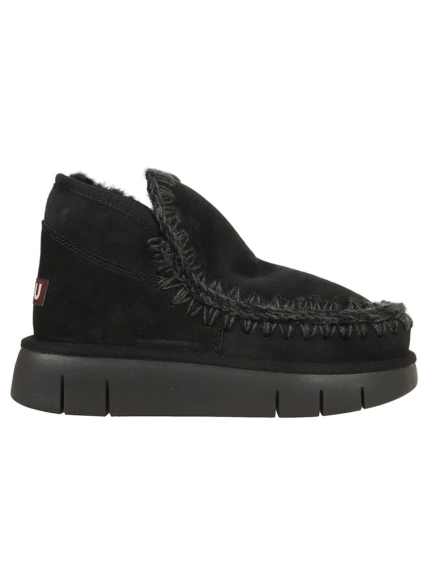 Moccasin-Inspired Ankle Boots with Whipstitch Detailing