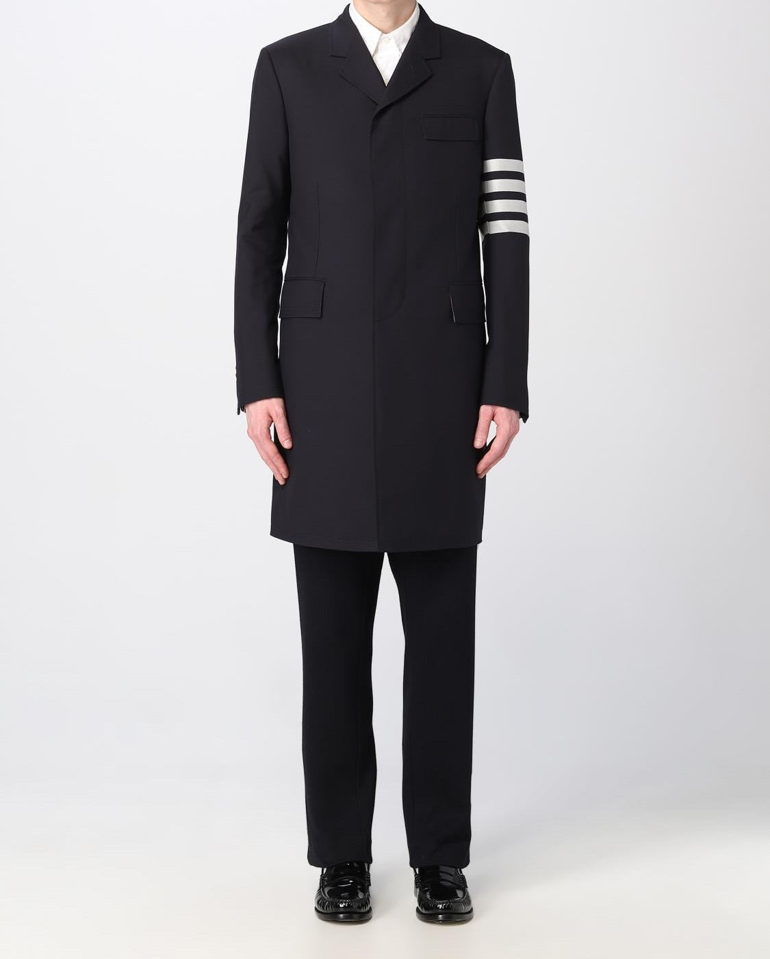 Tailored Black Coat with Asymmetrical Front and Signature Stripe