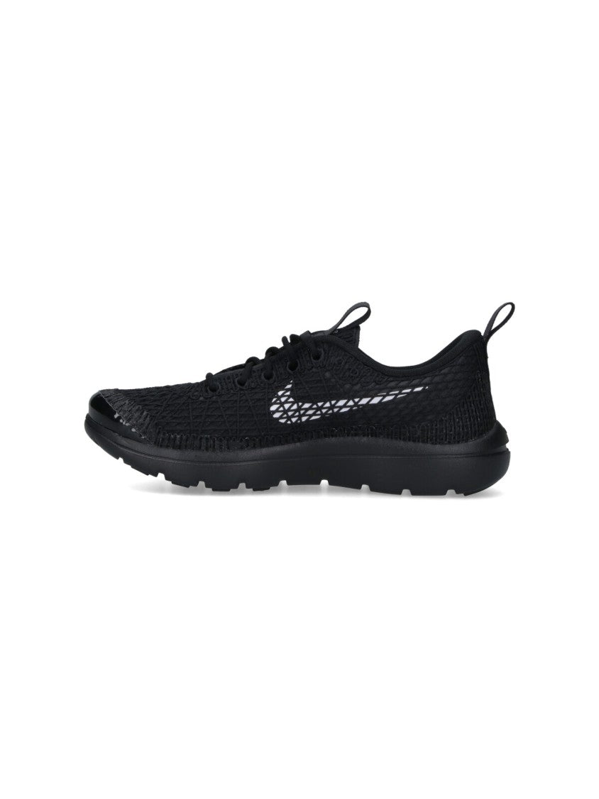 Textured Black Sneakers With Low-Profile Design And Distinctive Branding