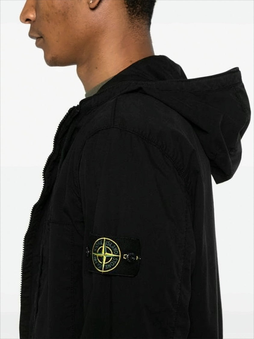 Minimalist Black Jacket with Distinctive Patch Logo