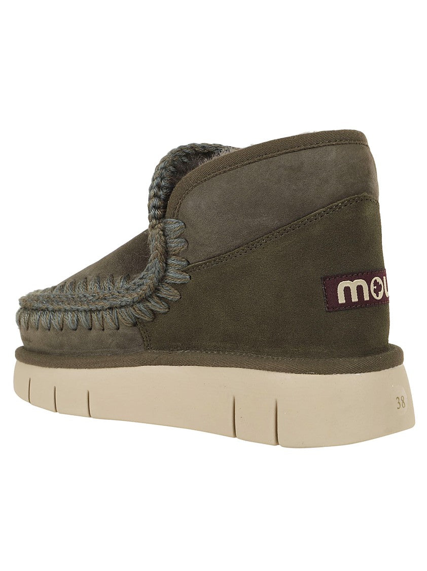 Moccasin-Inspired Ankle Boots With Whipstitch Detailing