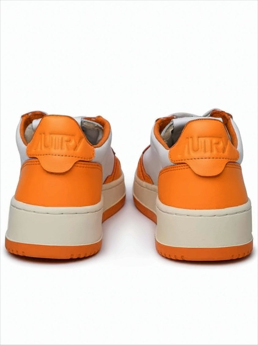 Low-Top Sneakers with Vibrant Orange Overlays and Perforated Detailing