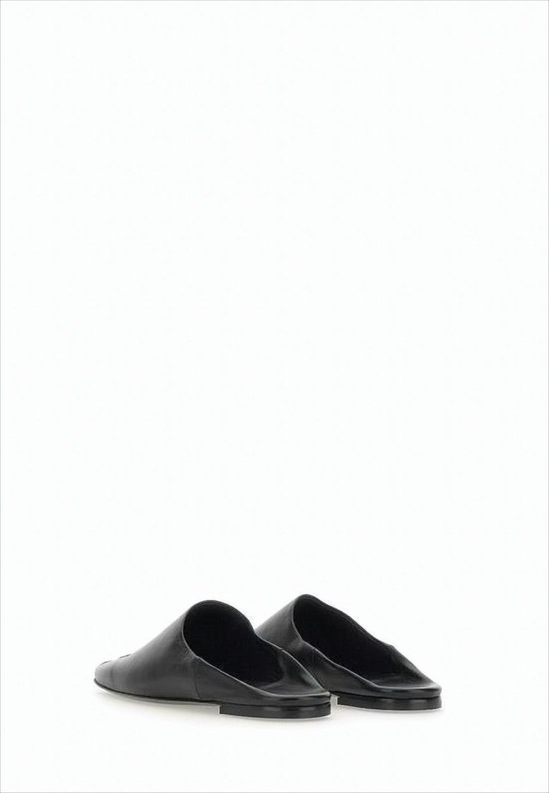 Minimalist Black Lambskin Slip-On Mules with Embossed Detail